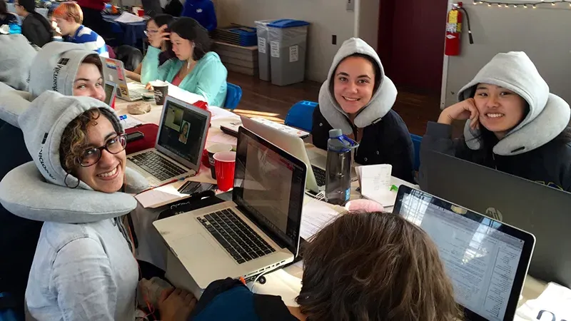 Students working on computers wearing Microsoft attire